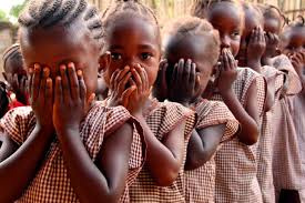 Girl child in rural setting looking thoughtful
